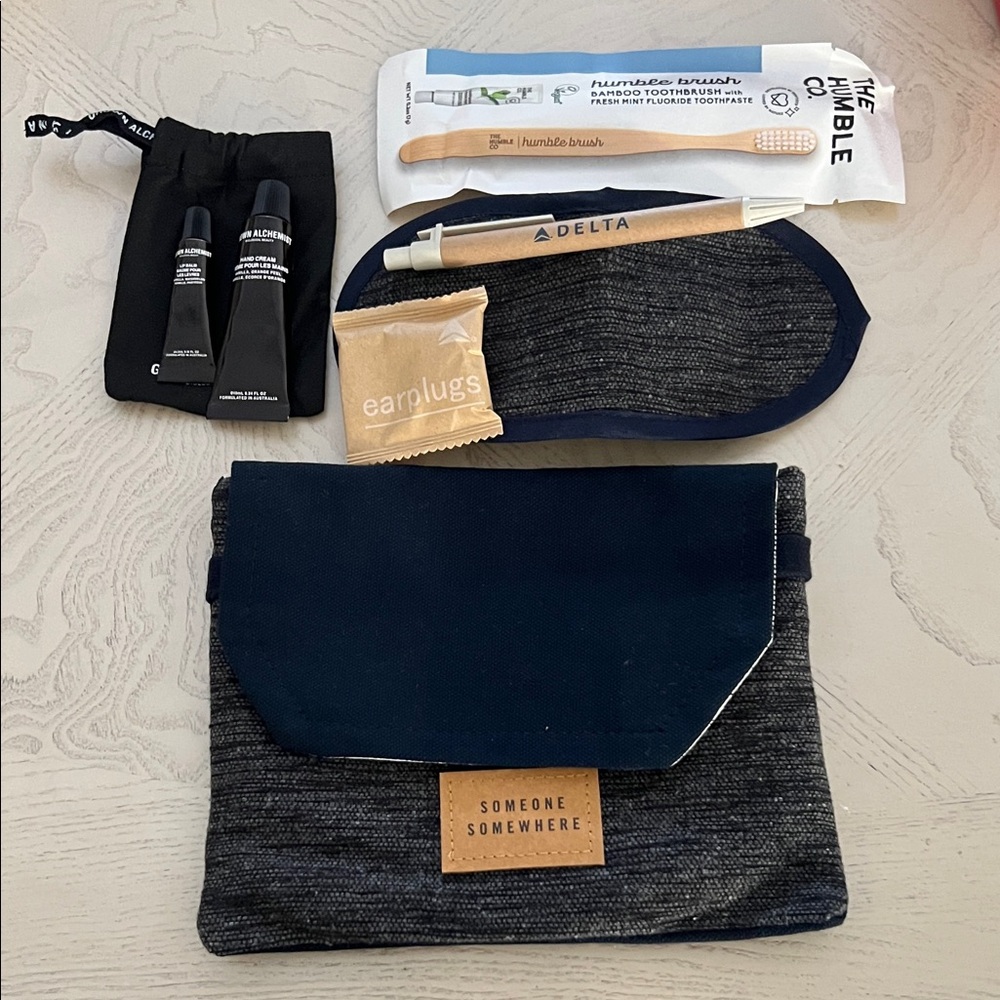Bag/Pouch with toothbrush pen eye mask earplugs lip balm hand cream for travels